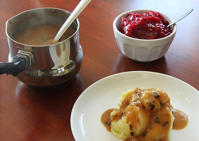 mashed potato and vegan gravy with cranberry sauce