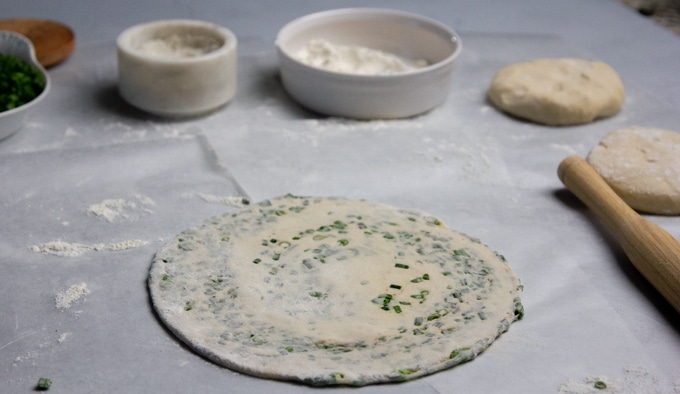 Chinese scallion pancakes being rolled out
