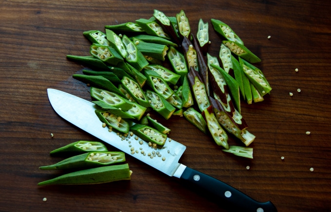 okra and a knife on a cutting board