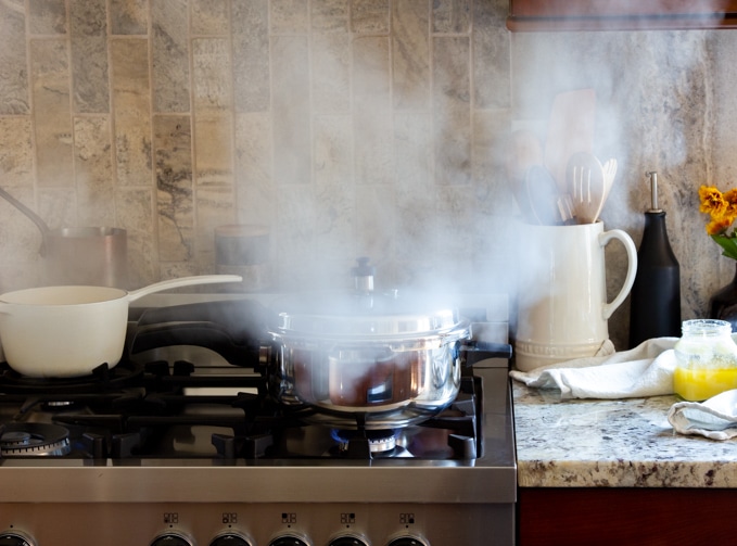A pressure cooker releases its steam