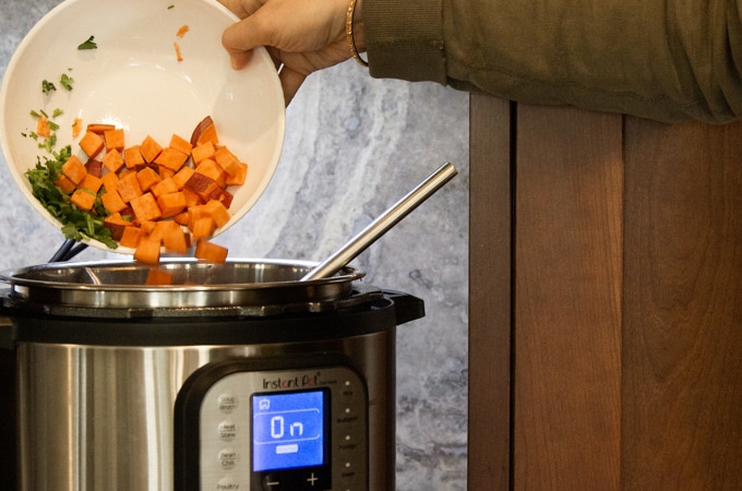 Adding sweet potatoes to the Instant Pot