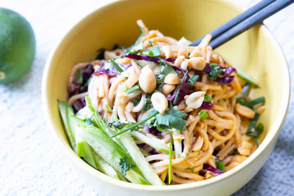 sesame peanut noodles in a bowl