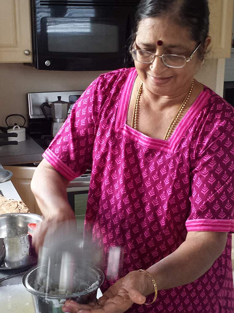 Indian mom cooking in kitchen